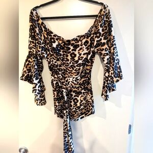Sexy off the shoulder leopard print blouse.  Tie waist.  Fits 1X - 3X